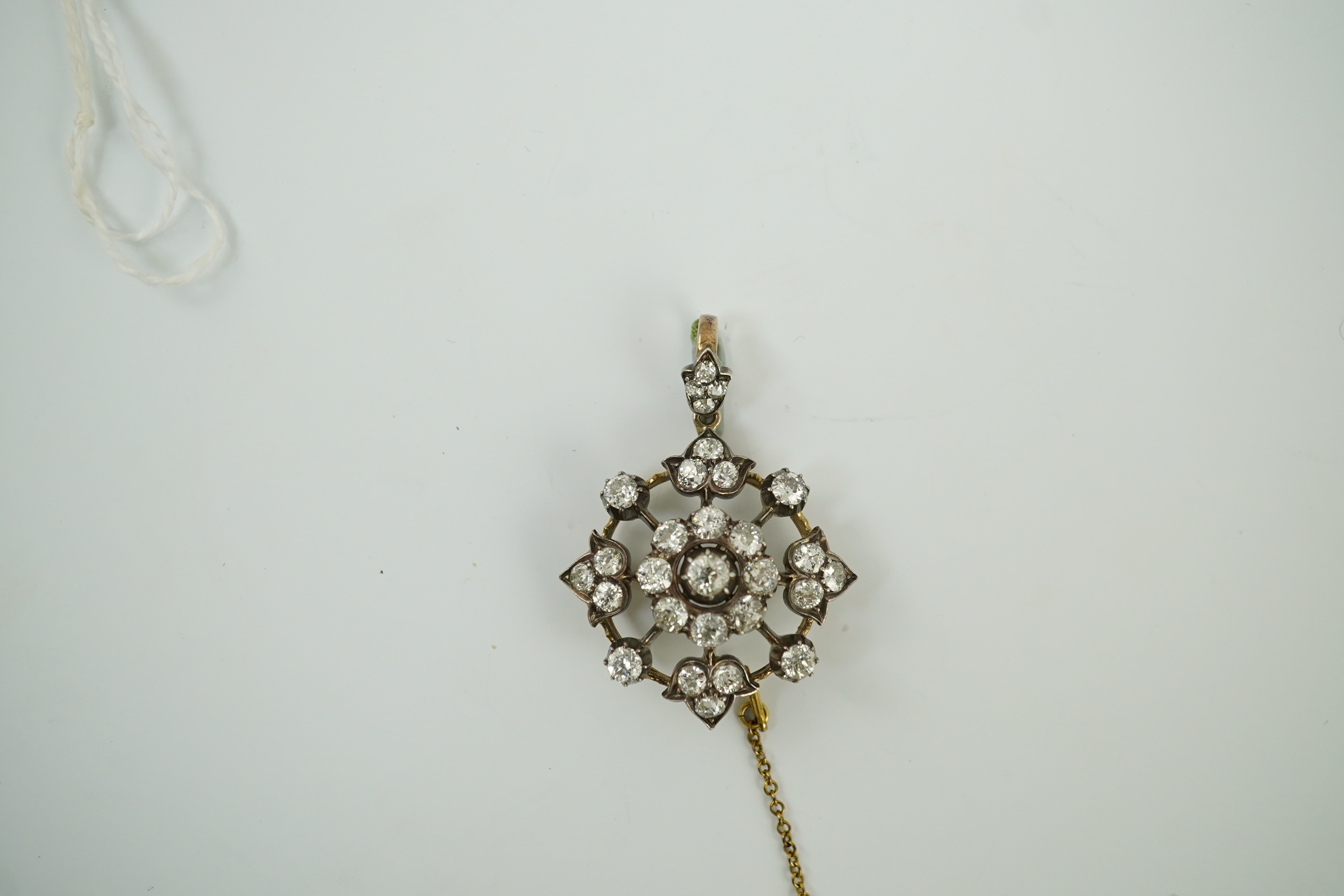 A late Victorian gold, silver and diamond cluster circular pendant brooch